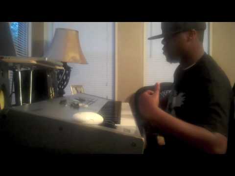 Mike Kalombo makes music in a Den